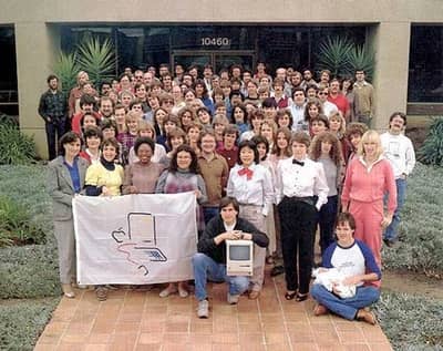 1984 - Steve poses with the Macintosh team outside their office