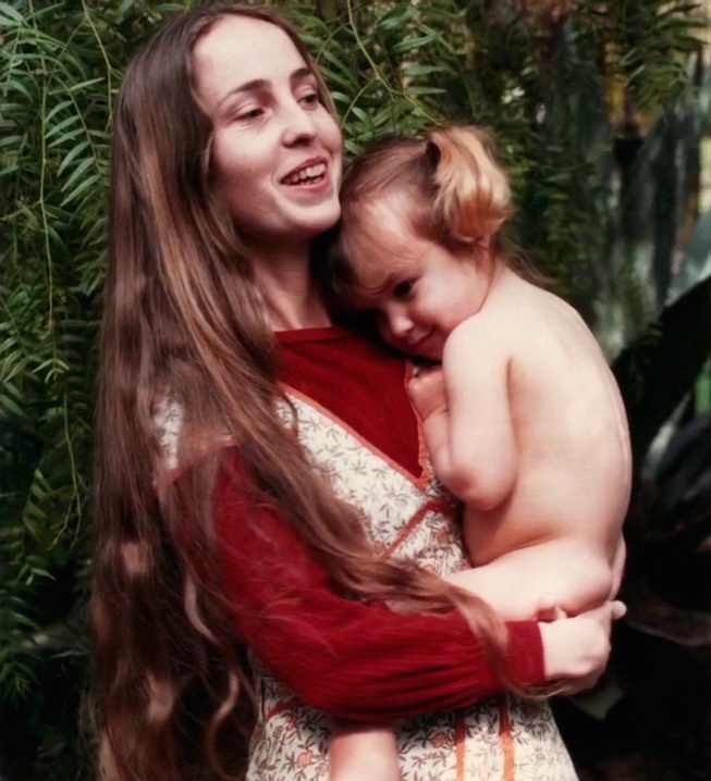 Chrisann Brennan holding her daughter with Steve, Lisa, 1979