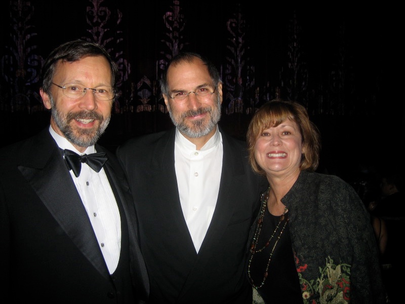 Steve surrounded by Ed Catmull and his wife Susan, 9 Oct 2004
